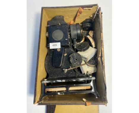 An antique baby projector with films in fitted case 