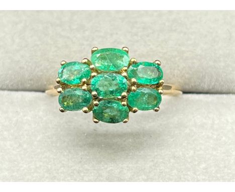 10ct yellow gold ring set with seven oval cut emerald gem stones. (Ring size Q) (2.27grams) 