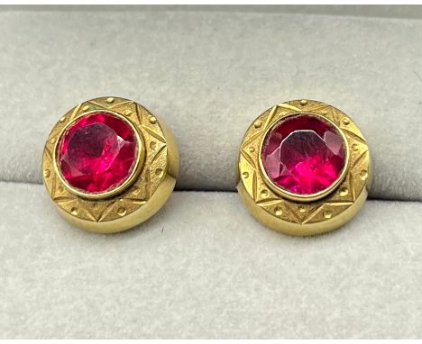 A Pair of 14ct yellow gold earrings fitted with Round Cut Ruby gem stones. [2.69grams] 