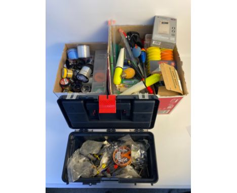 A Large collection of fishing tackle; fishing gut, head lamp, hooks and fishing tackle box with weights 