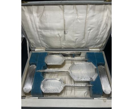 Boxed vintage Sheffield silver dressing table set; Four hand brushes, hand mirror and comb. Produced by Daniel Manufacturing 