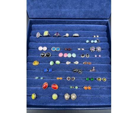 A jewel box containing mixed silver and costume jewellery; three silver and enamel buttons, silver and gem stone rings, silve