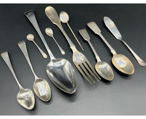 A Selection of silver flat wares; Georgian London silver serving spoon, London silver dinner fork and various silver tea spoo