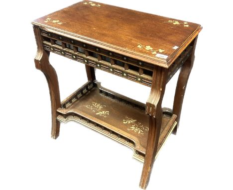 19th century table, the rectangular top above a bar frieze and lower gallery shelf, with gilt painted detail, raised on out s