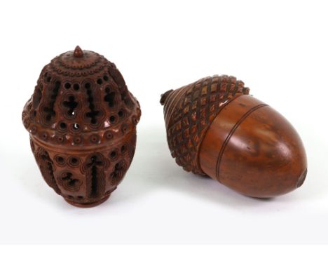 Two small wood containers with screw-off tops, one carved and pierced with holes and crosses surmounted by a finial, 7cm, the