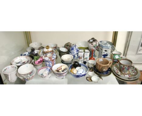 A large quantity of Chinese and Japanese ceramics, 19th and 20th Century, including vases, cups, saucers and tea bowls (qty).
