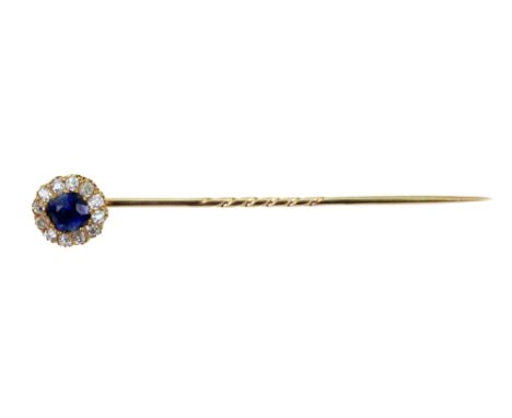 A sapphire and diamond cluster stick-pin, late 19th century, the central cushion shaped sapphire approx 1.60cts, within a 12-