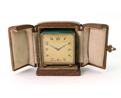 An Art Deco silver gilt cased timepiece, English Import marks and detailed sterling, the square case with green glass panels 