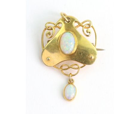 An Art Nouveau gold and cabochon opal pendant by Murrle Bennett and Co., centred by an oval cabochon within an inverted heart