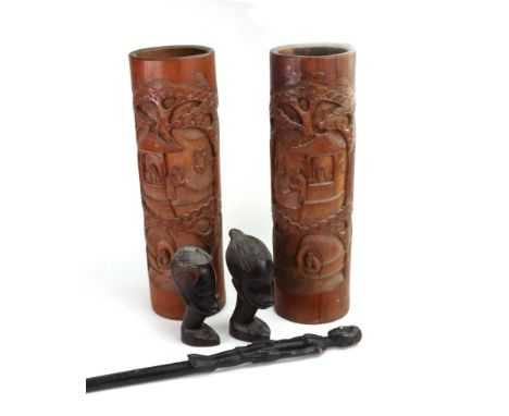 An African ebonised carved figural stick, 72cm long, two African carved hardwood busts, and a pair of Chinese carved bamboo b