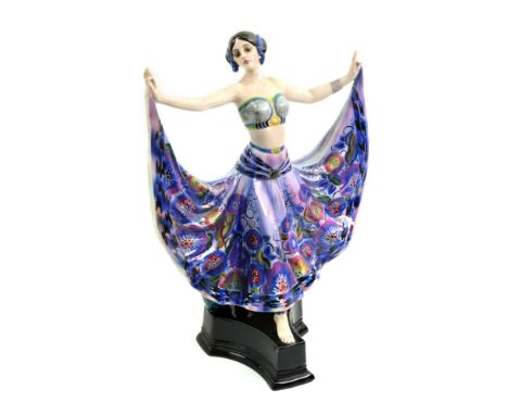 A Goldscheider hand decorated pottery figure of a dancer, standing on a concave sided plinth base, 37cm high.Illustrated