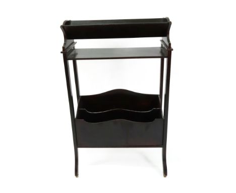 J C Vickery: an Edwardian mahogany book stand, with a book trough above two divisions for periodicals, on rolling ball castor