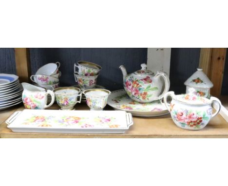 A Paris porcelain part tea service, painted with flowers, fourteen pieces, four similar tea cups and saucers and other French