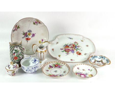 Two Dresden saucers, painted with flowers, similar tray, of shaped outline and a small sugar bowl and cover with flower finia