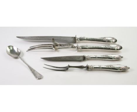 A pair of French silver handled steel carving knife and fork, Paris, late 19th century, foliate embossed and engraved handles