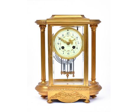 Tiffany & Co France:  A gilt metal cased mantel clock, circa 1900, of architectural style, with reeded columns, the cream ena