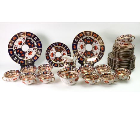 An English porcelain tea service, late 19th century, Imari pattern, gilt heightened, comprising: twelve each cups, saucers an