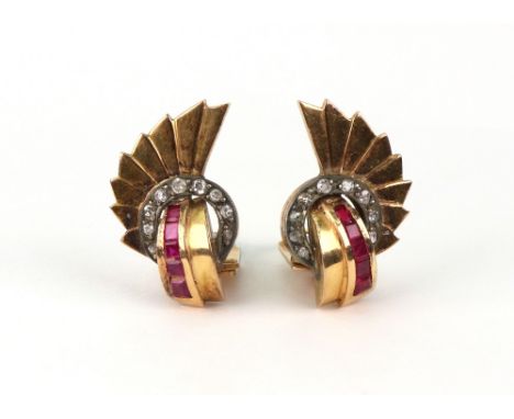 A pair of synthetic-ruby and diamond fan shaped ear clips, circa 1950, each with a calibre synthetic-ruby bands, a small diam