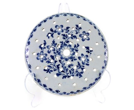 An English Delftware blue and white circular drainer, probably London, circa 1760, pierced with rows of circular and heart sh