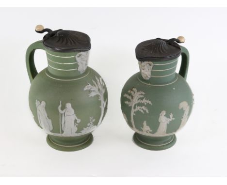 Two Wedgwood green Jasper dip jugs, decorated with classical scenes and with pewter covers, impressed Wedgwood, one 19cm high