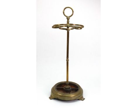 A Victorian brass six-division stick stand, with turned cylindrical column, the spreading circular base on splayed feet, 58cm