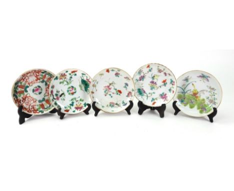 A group of five Chinese famille-rose saucers, 19th century, variously painted with flowers, fruit and insects, 13.5cm diamete