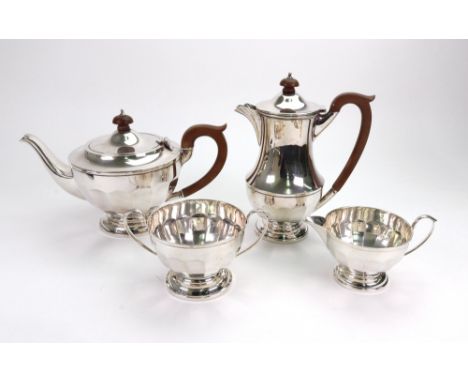 An Art Deco four-piece silver tea service, H.C. Davis, Birmingham 1930 and 1931, of panelled circular form, on spreading circ