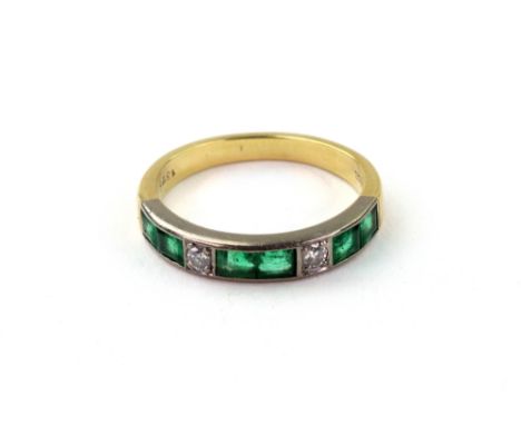 An emerald and diamond half hoop ring, with three pairs of calibre-cut emeralds divided by two brilliant-cut diamonds, on a y