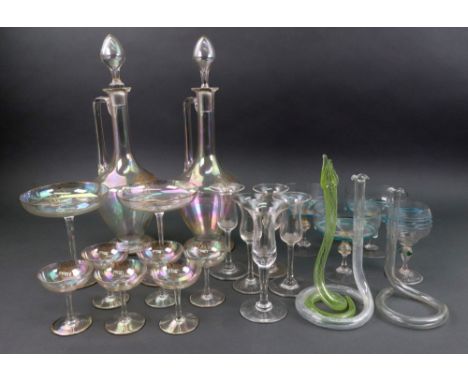 A part suite of iridescent glassware, circa 1920's, with gilt rims and monogram, pair of decanters, two champagne saucers and
