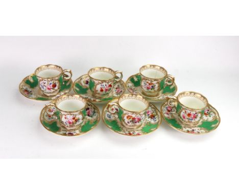 A set of six English porcelain coffee cups and saucers, circa 1830, painted with panels of flowers against an apple green gro