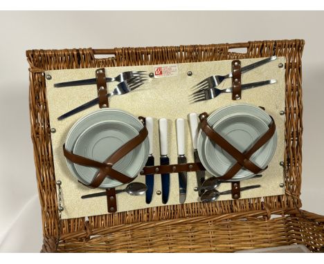 A Optima picnic set in a wicker hamper comprising, cutlery, plates, thermos and cups etc. (h-21cm l-55cm)&nbsp;