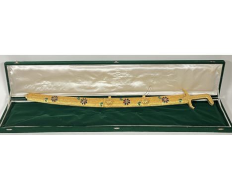 A gilt metal filigree and enamel Omani presentation sword with green velvet case