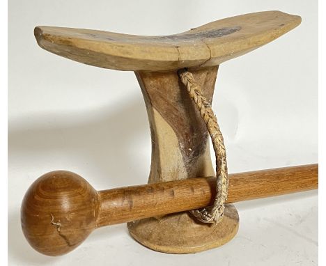 Tribal art, a carved wood African headrest with chorded handle, together with a carved wood club/mace (l- 51cm)