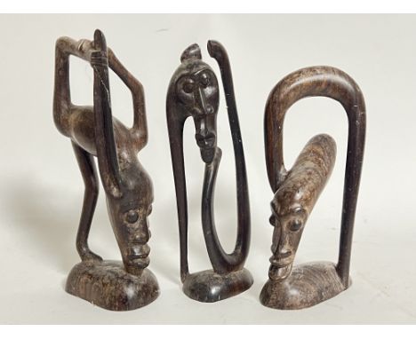 A group of three carved wooden African tribal art folkloric figures/desk ornaments (tallest h- 19cm)