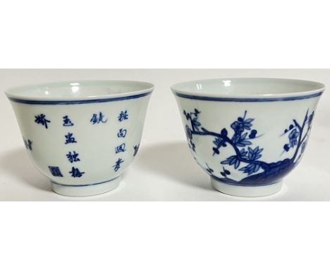 A pair of modern Chinese blue and white porcelain wine cups each typically decorated with floral blossoms and calligraphy poe