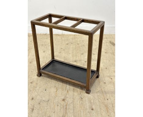 An Edwardian oak Arts &amp; Crafts style three division stick stand with inset metal tray (h.62cm x l.61cm x w.30cm)