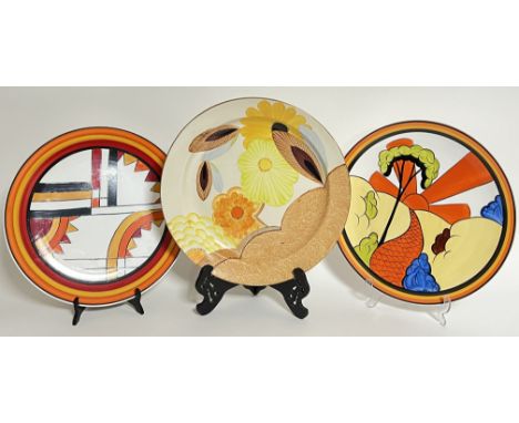 Three large decorative ceramic plates/chargers variously decorated in bright colours including Art Deco and floral designs (l