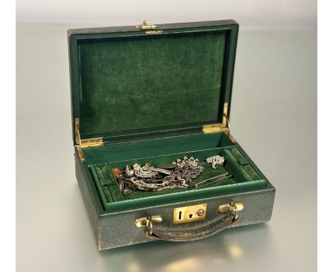A vintage green leather A Boswell of Edinburgh jewellery case with fitted interior and velvet lined interior containing a col