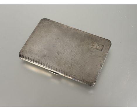 A Birmingham silver engine turned decorated cigarette case with initials B.D.M: l. x 13cm Birmingham 1946 181g&nbsp;