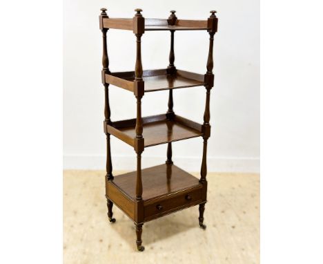 A Victorian mahogany four tier shelf stand, with drawer to base, brass caps and castors (h.142cm x l. 54cm x w.43cm)