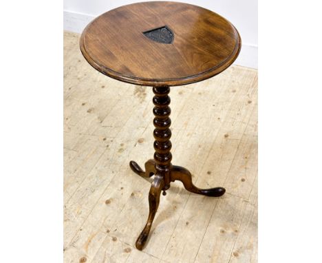 A Victorian walnut circular pedestal lamp table with carved shield with three fish on bobbin turned support (h.76cm x d.46cm)