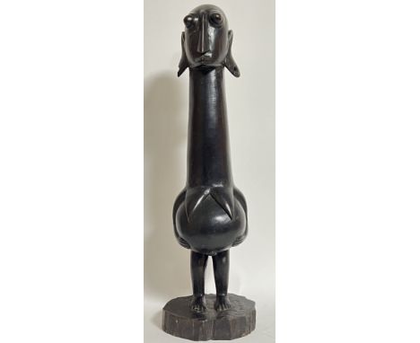 A large carved wood tribal art fertility figure modelled as a pregnant woman, marked 'Mating' to base (h- 57cm)