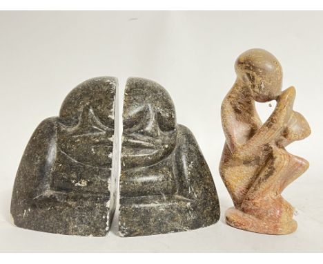 Shona Art, R Mteki, a pair of carved soapstone Zimbabwean book ends in the form of traditional figures, together with another