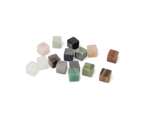 Fifteen cube mineral specimens, each cut and polished to highlight natural formations, including tiger eye, black obsidian, g