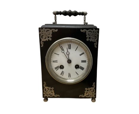French-Ebonised 8-day wooden mantle clock c1890, with silvered mounts, decorative carrying handle and raised on ball feet, wi