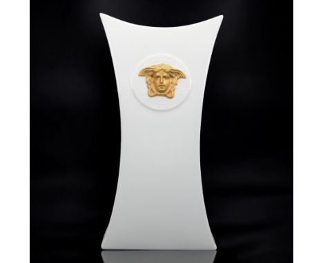Rosenthal Versace Gorgona vase, of concave form, decorated in relief with medusa masks and gilt greek key borders upon a whit