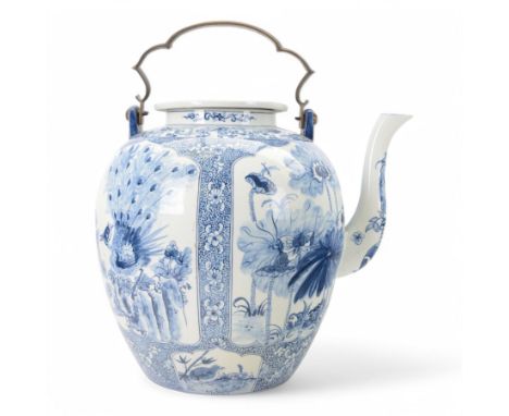 Oversized oriental blue and white teapot, the panels decorated with birds amongst blossoming branches, with a metal handle, f