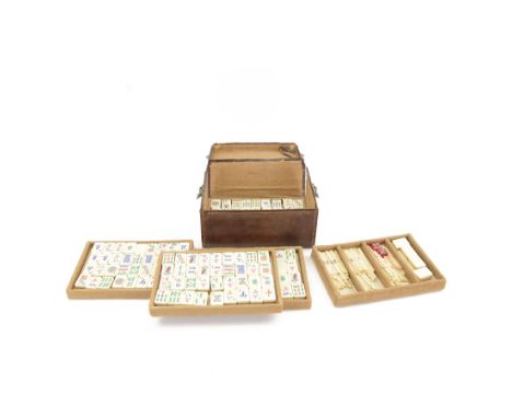 20th century Chinese Mahjong set, with five trays containing bone counters and tiles, contained within a leather bound travel