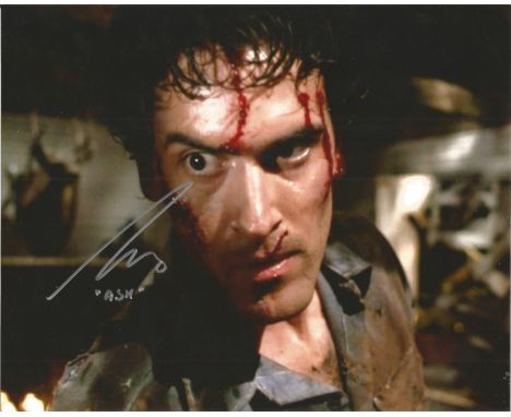Bruce Campbell The Evil Dead hand signed 10x8 photo. This beautiful hand signed photo depicts Bruce Campbell as Ash in the hi