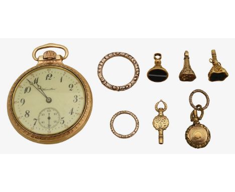 A collection of 19th century split rings, watch keys and fobscomprising two foliate chased split rings, a watch set with a sh